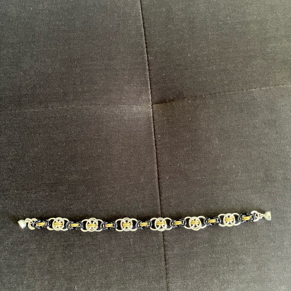 Elegant Artisan Gold tone and Black Bracelet. 7” length. Woman owned business
